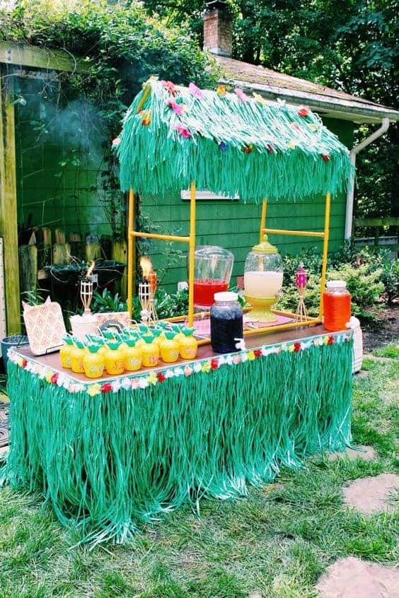 09 | GRASS TABLE SKIRTS, TIKI TORCHES, AND LEIS